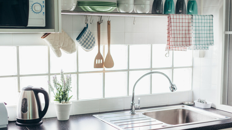 Above kitchen sink storage