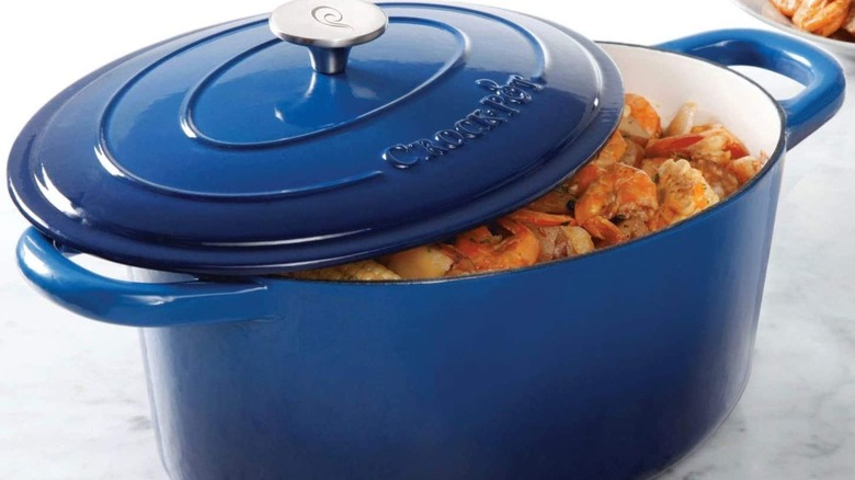 Blue Crock-Pot Dutch oven with shrimp dish inside
