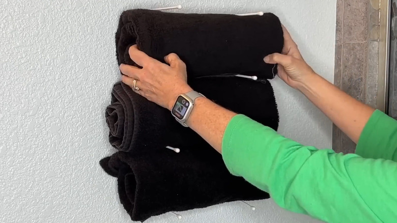 A DIY hand towel rack for the wall.