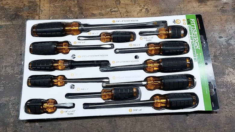The Pittsburgh 12-piece cushion grip screwdriver set displayed over a wooden surface.