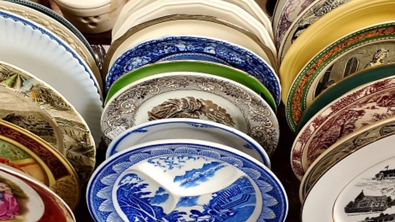 Rows of vintage plates with intricate designs