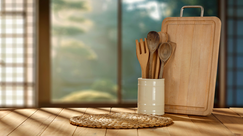 Kitchen wooden utensils and tool on wooden table top
