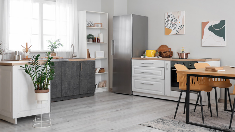 Gray kitchen with wood accents and plants