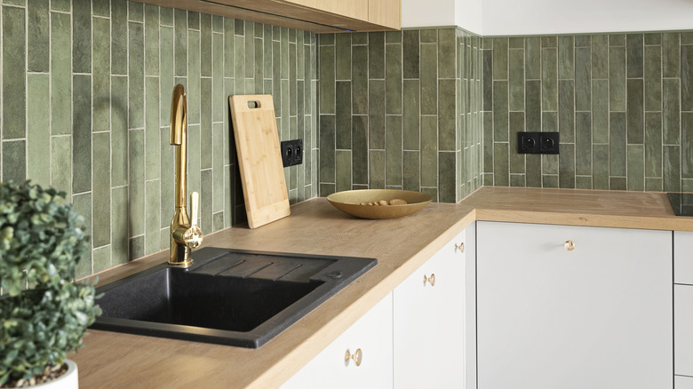 Green tile backsplash in kitchen