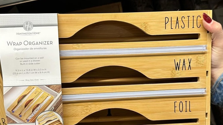 Hand holding bamboo wrap organizer