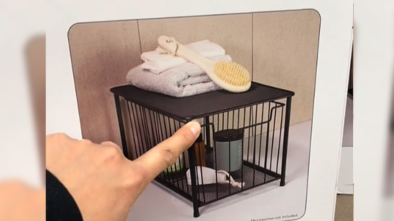 Hand pointing to product box