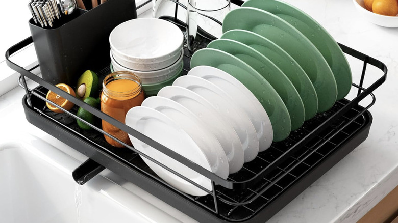 Dish drying rack with a drainage pipe in kitchen