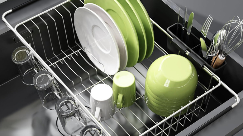 Suspended dish drying rack over sink