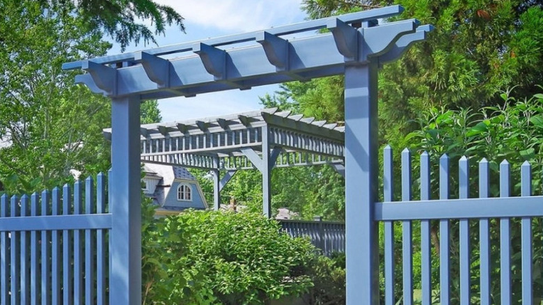 Vinyl privacy gate in yard