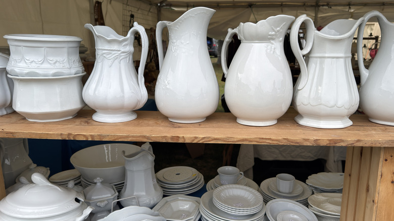 Variety of ironstone crockery at flea market
