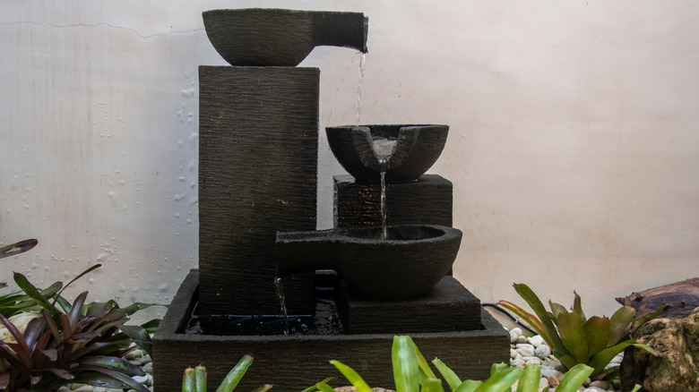 small outdoor water fountain in backyard