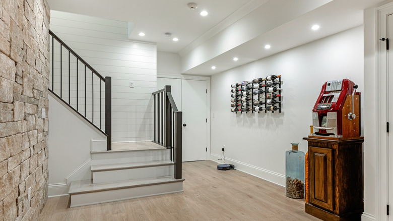 Basement with recessed lighting and stone wall