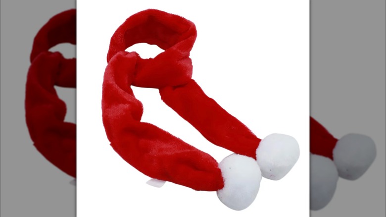 Red Christmas house scarf with white cotton balls on each end.