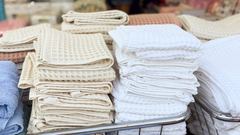 Close-up of dish towels stacked in store bin