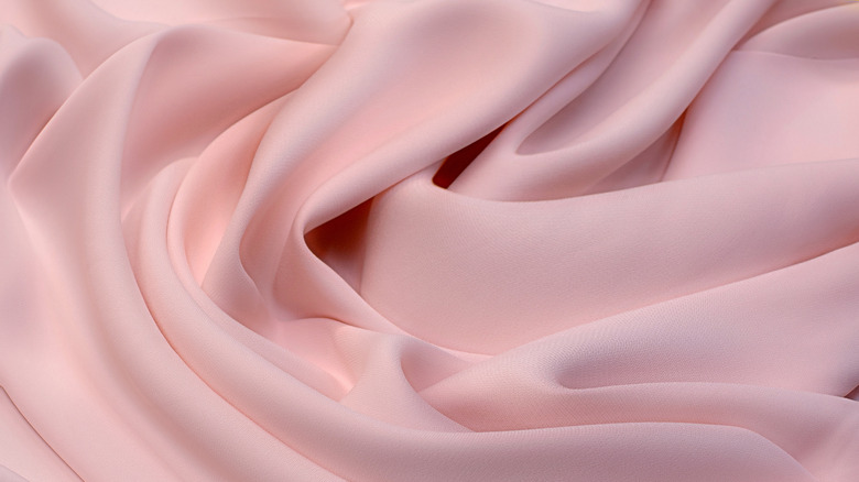 Close up of pink rayon fabric