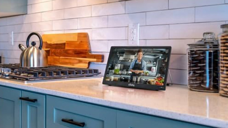 The Exuby TV on a white stone kitchen counter.