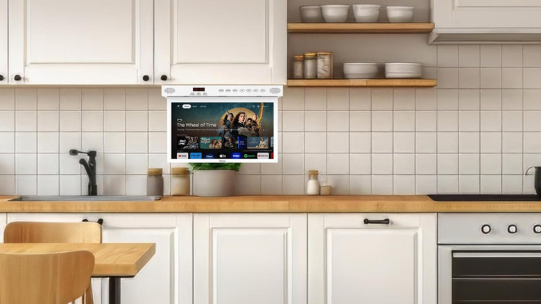 A Sylvox tv mounted under a kitchen cabinet