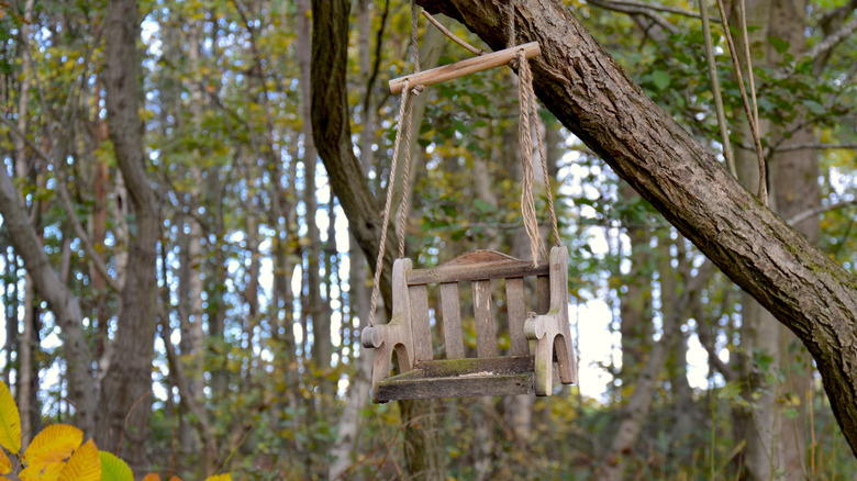Hanging bird bench made of old wood