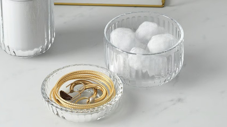 SILVTJÄRN container holding cotton balls and jewelry