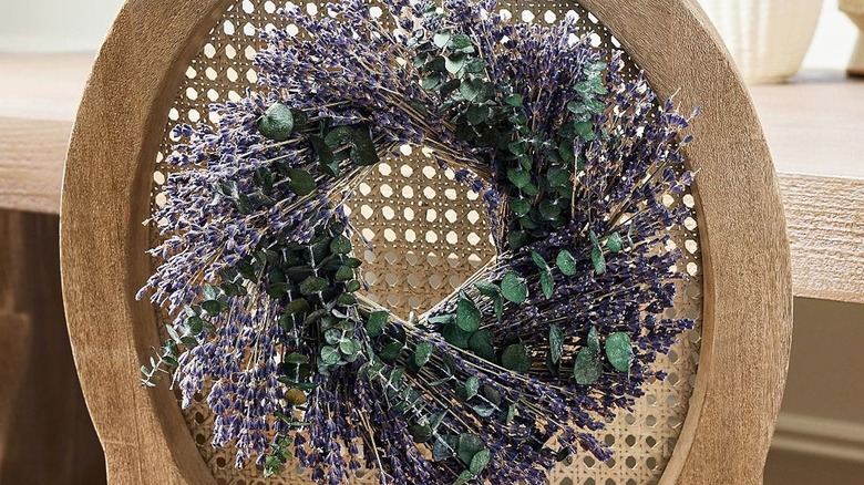 Dried lavender mini wreath hanging on the back of a chair