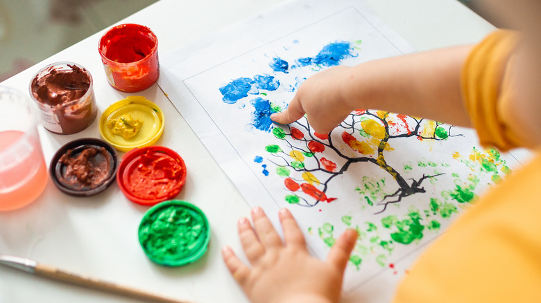 child finger painting 