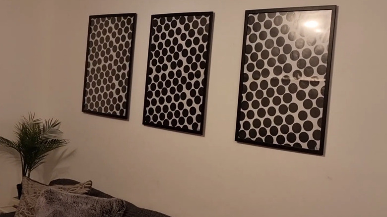 Three frames containing wrapping paper