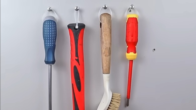 tools hanging from zip ties