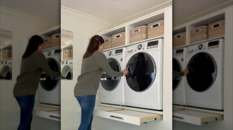 Woman closing washer door