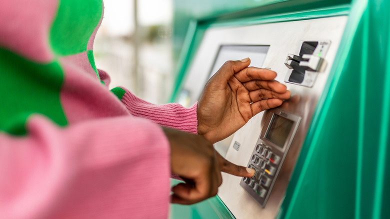 A person using an ATM machine