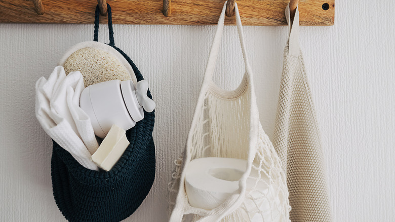 Toilet paper in mesh bag on hook