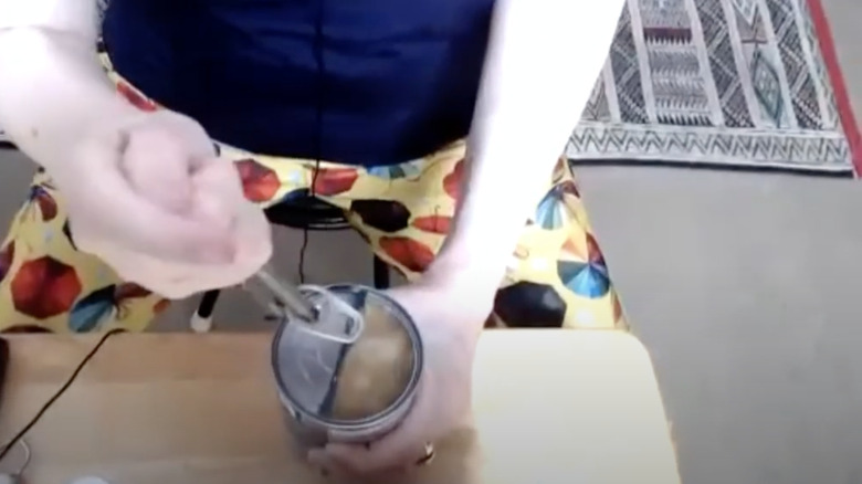Opening a pull ring with a bottle opener