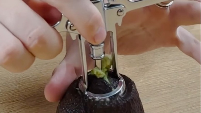 Remove an avocado pit with a wine bottle opener