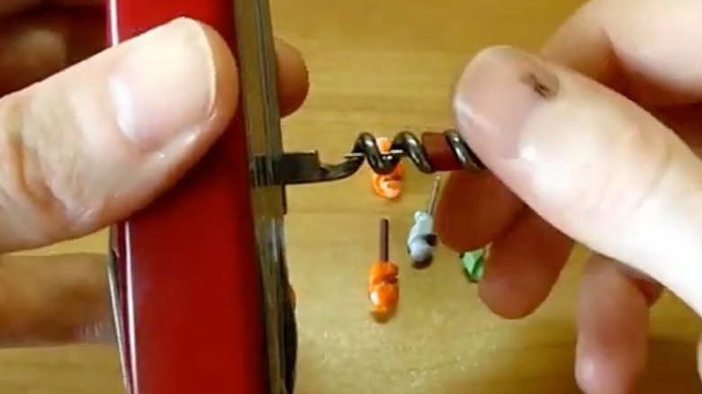 Storing a mini screwdriver in a corkscrew