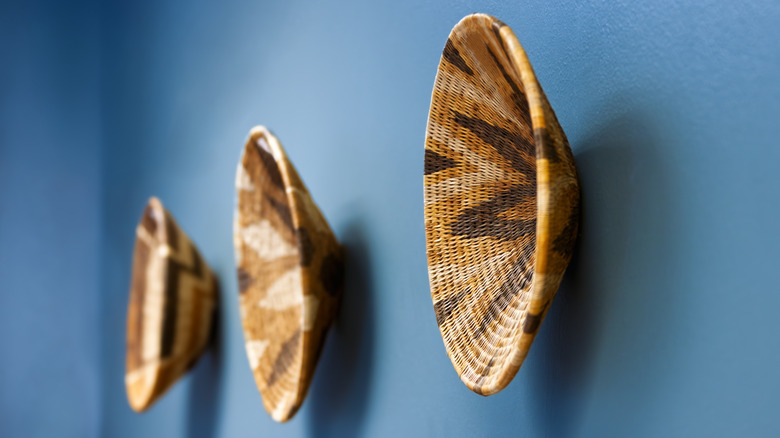 African baskets hanging on a wall