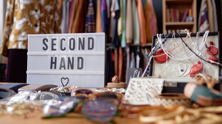 A thrift store with a sign that says 'second hand'
