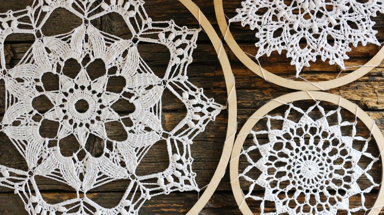 doilies in wooden frames