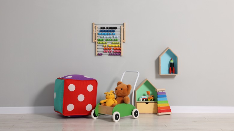 Kid's bedroom wall with some toys