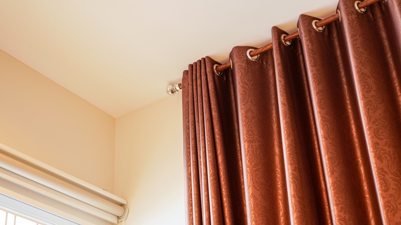 orange silk curtains on window