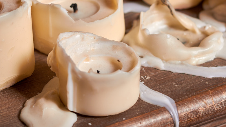 Partially melted cream-colored candles
