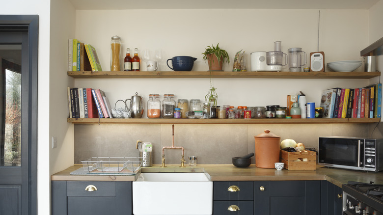 cluttered kitchen shelves above counter
