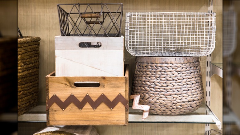 various storage baskets and bins on shelf