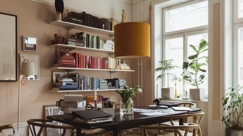 office with stacks of books on shelves