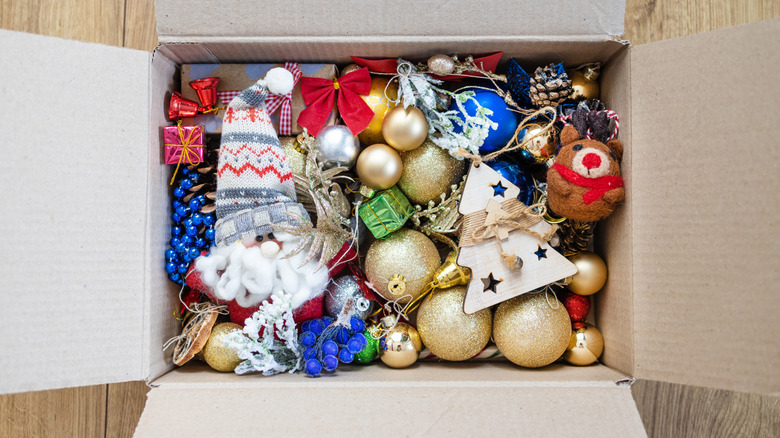 Box of tree ornaments of various colors and designs