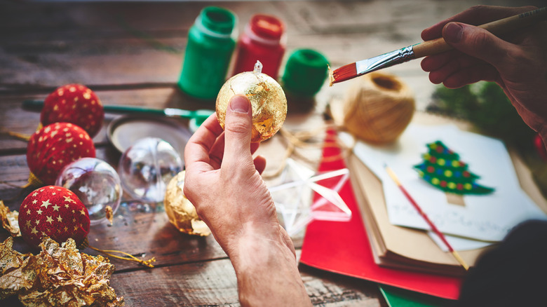 Person decorating a homemade ornament