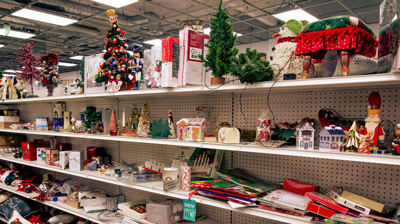 Various Christmas decor on a thrift store shelf