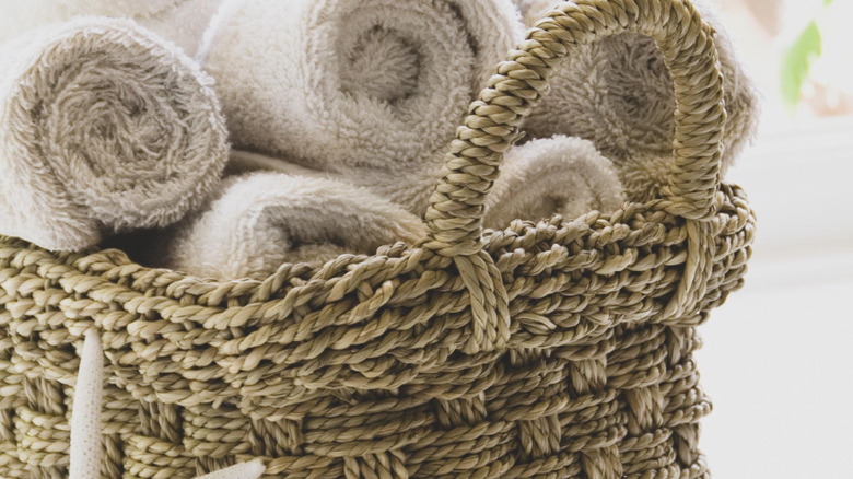 Basket of extra towels for a guest room