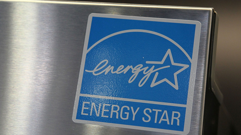 A blue Energy star label on the corner of a stainless steel appliance.