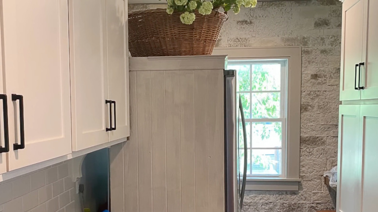 Custom beadboard panel on side of stainless steel fridge