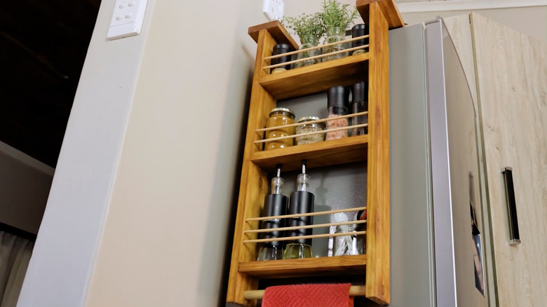 Shelf hanging from side of fridge