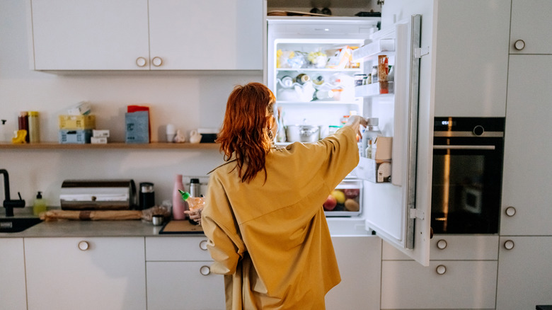 Person digging in hidden fridge